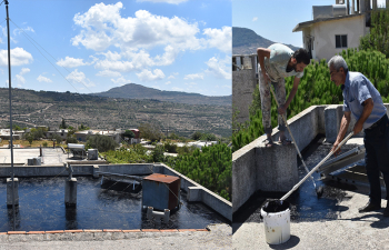 Repairing the roof of the medical point at al-Twaheen, Cadmus
